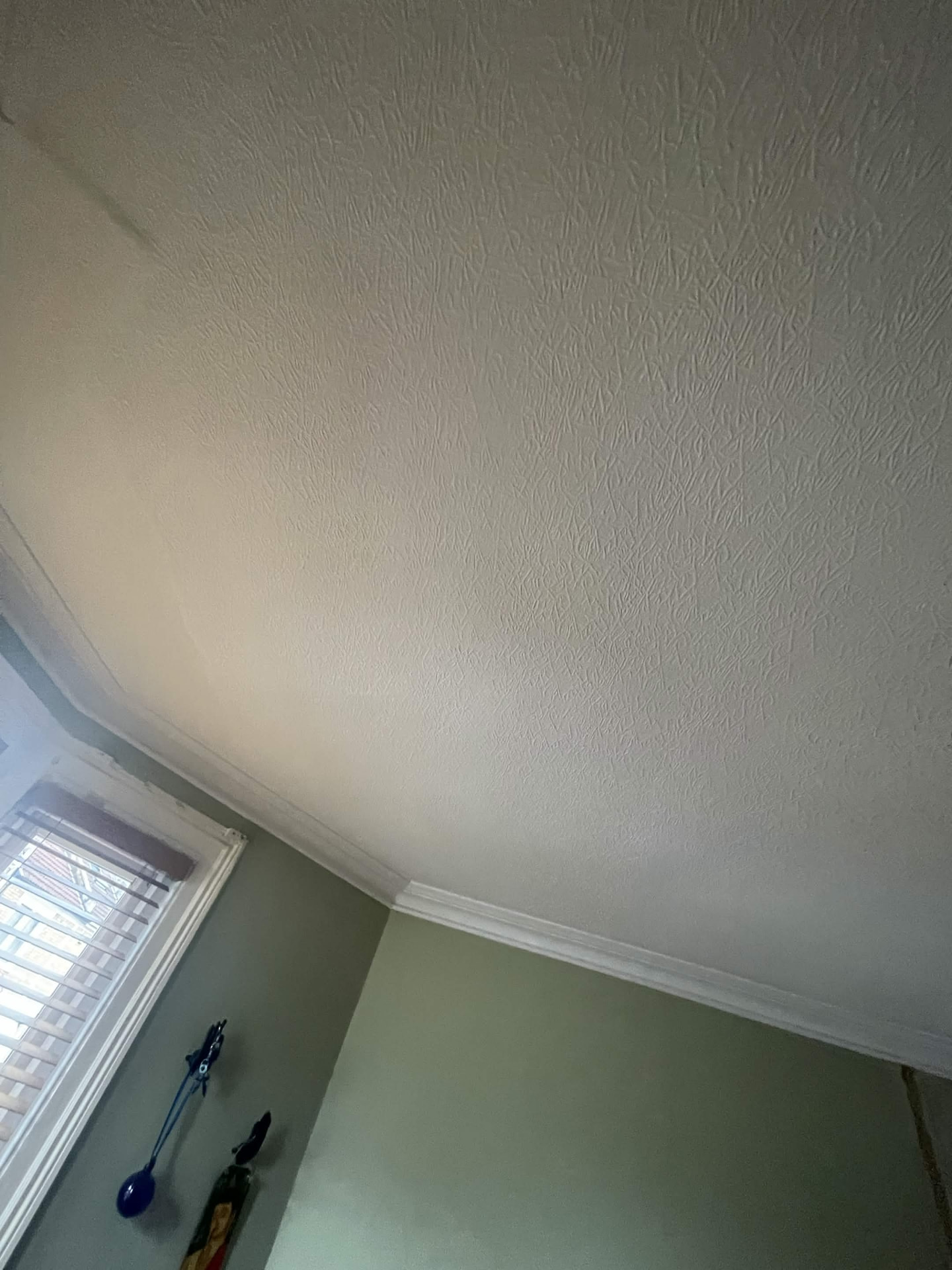 Artex ceiling skimmed over flat and smooth before plastering