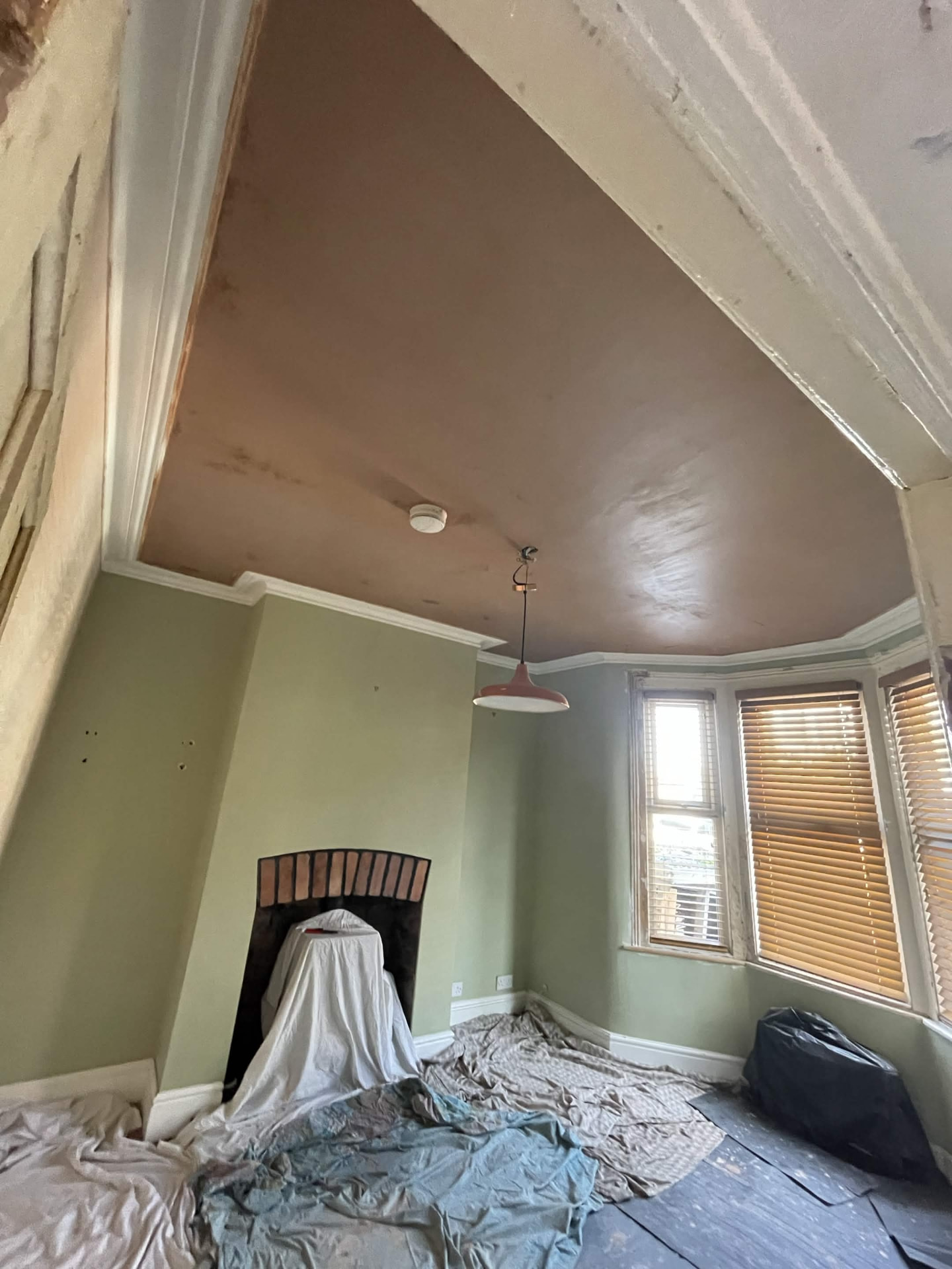 Artex ceiling skimmed over flat and smooth after plastering