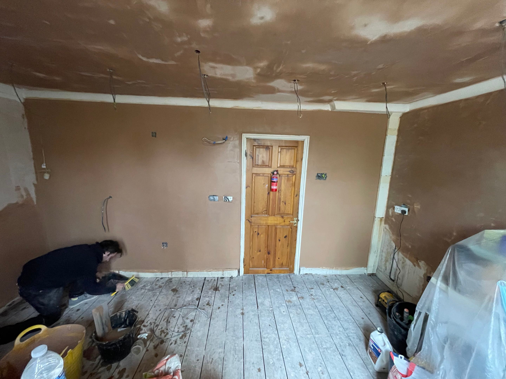Old lounge walls and ceiling reskimmed top to bottom after plastering