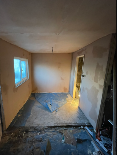 Boarded room taped and skimmed throughout after plastering