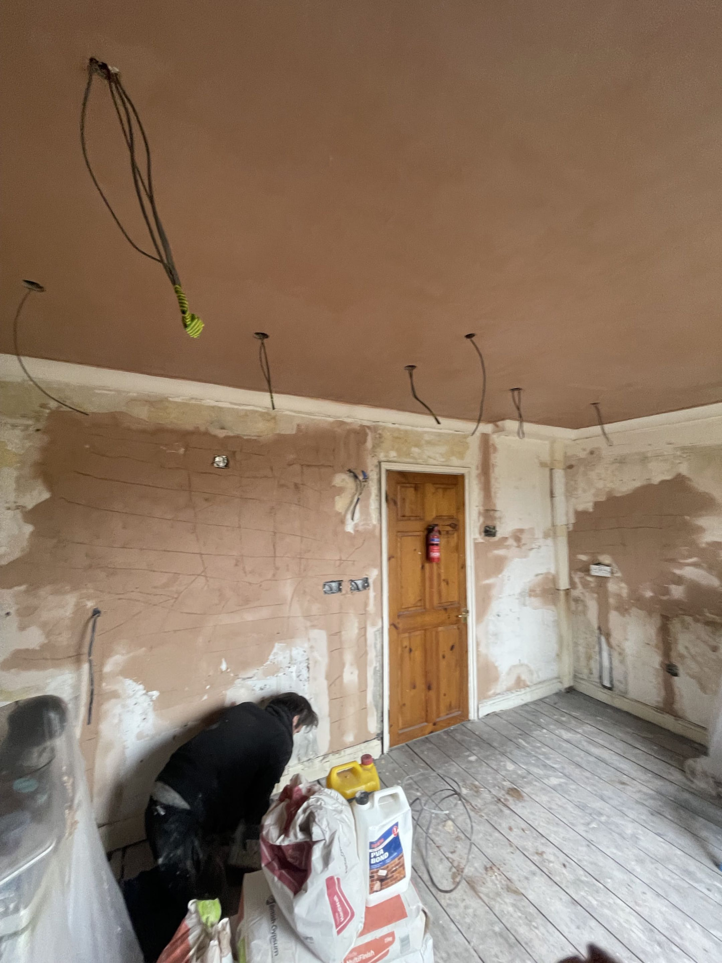Old lounge walls and ceiling reskimmed top to bottom before plastering